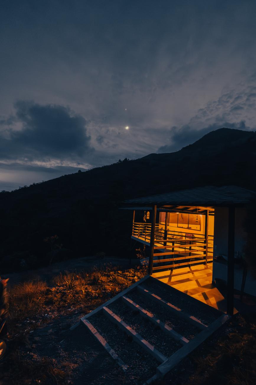 harmonica retreat location medellin maloka at night with the moon