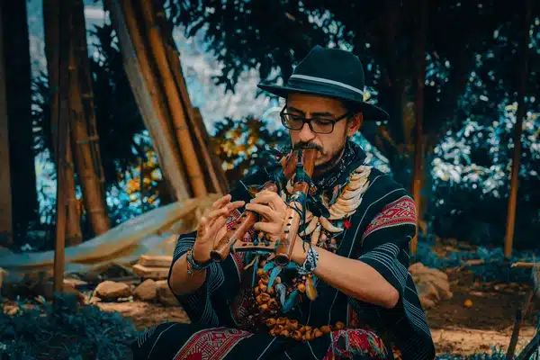 Sergio Henao, Harmonica’s yagecero, playing a traditional flute outdoors