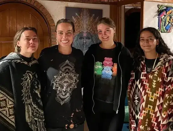 Four friends smiling together at the retreat
