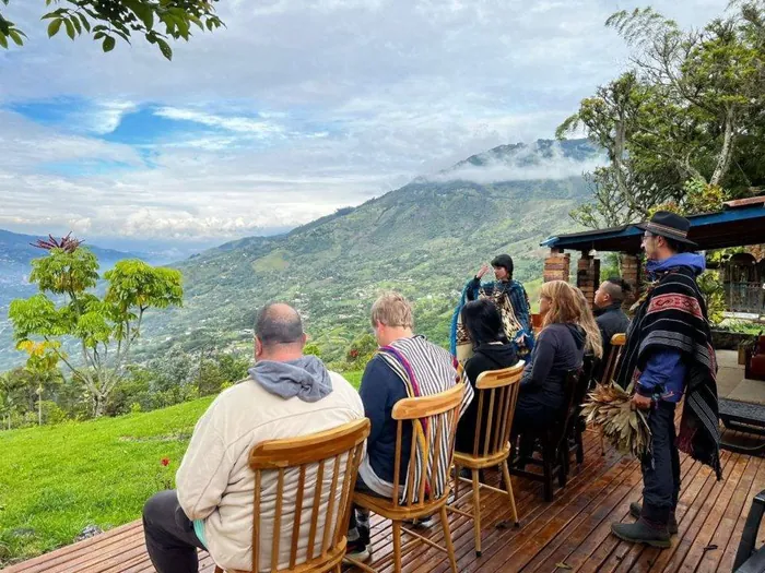 Participants gathered in a circle on the deck above the valley