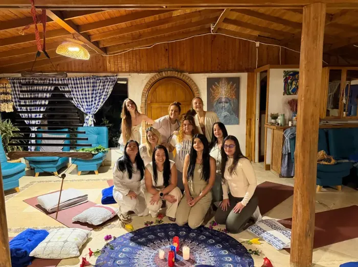 A group of women sitting together in the house