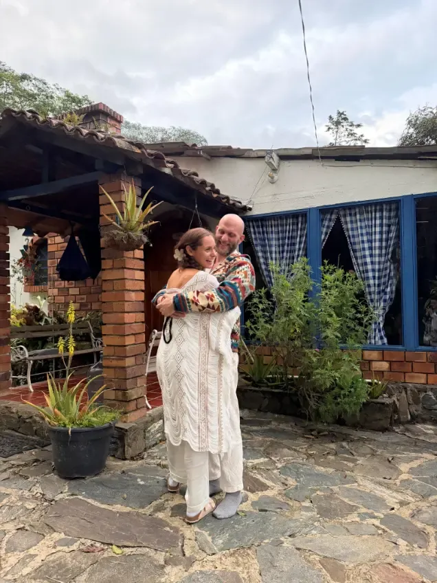 Two people hugging in the courtyard