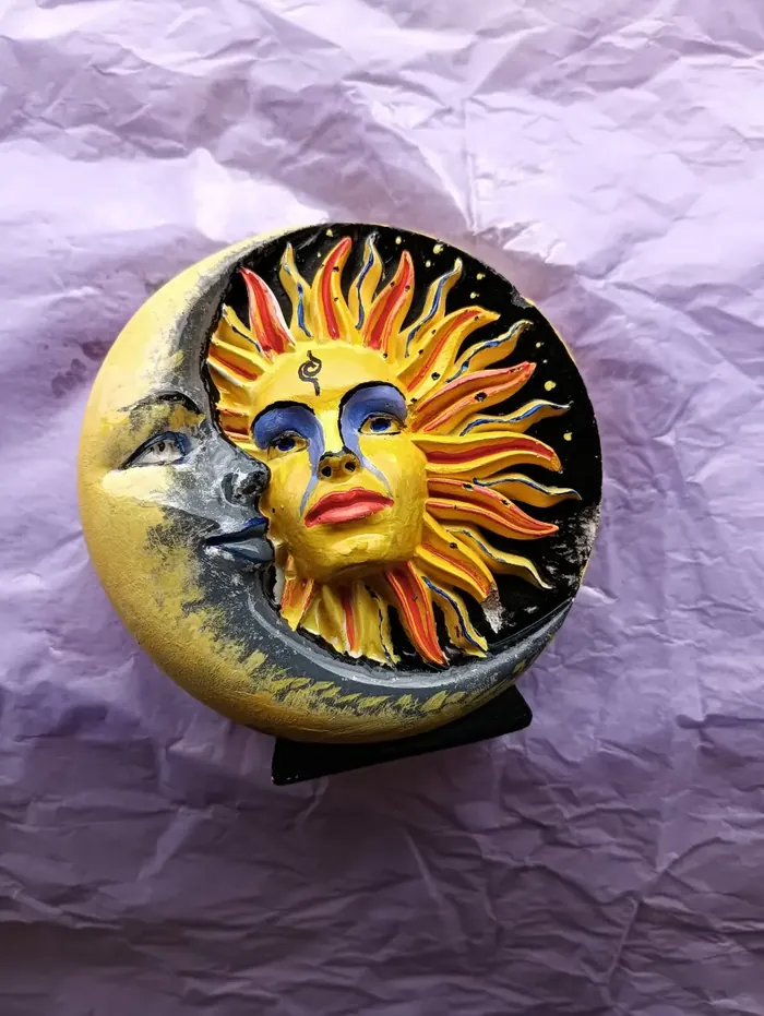 A painted sun and moon artwork