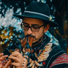 Sergio Henao, yagecero at Harmonica Retreat, playing a traditional flute